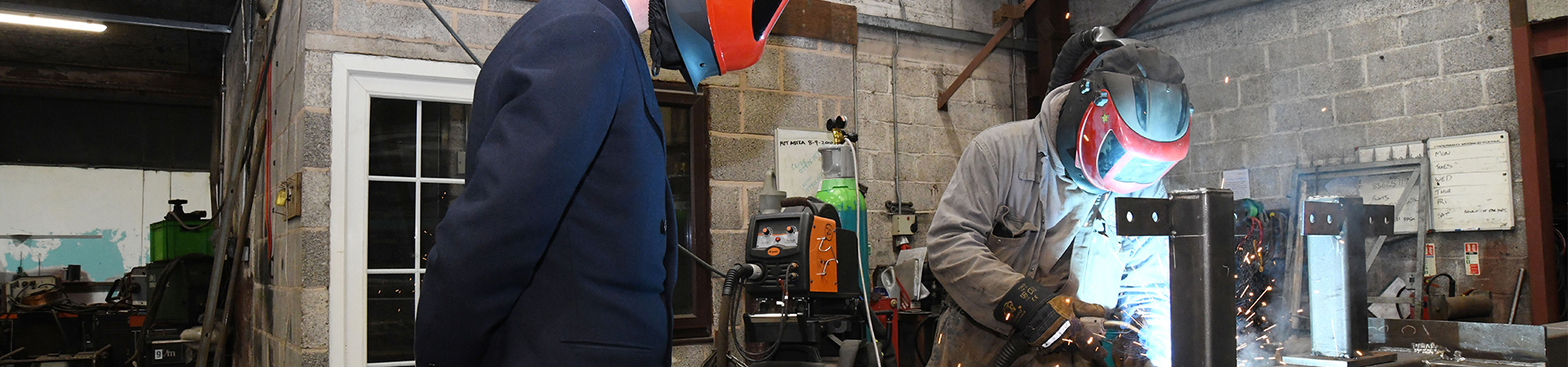 A fabricator welder working on structural steel